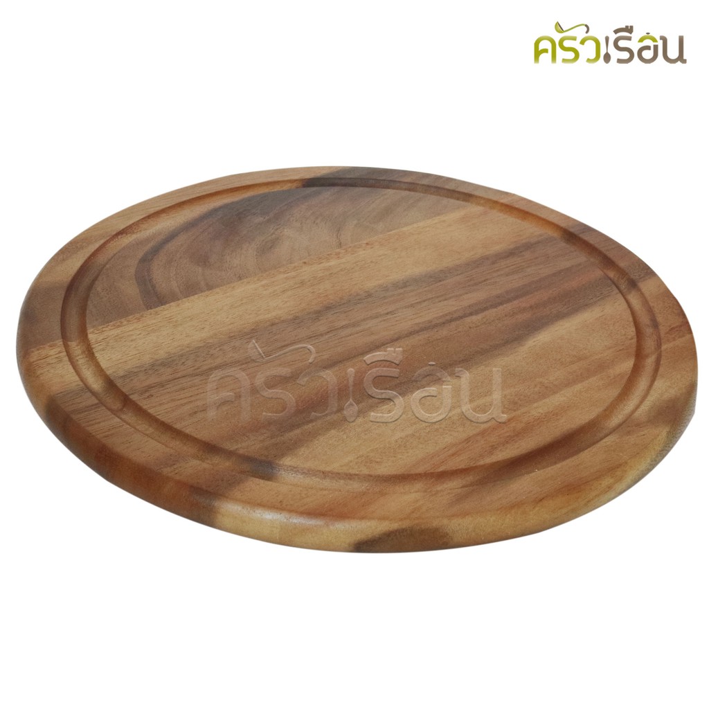 CMG Round acacia wood cutting board with grooves.