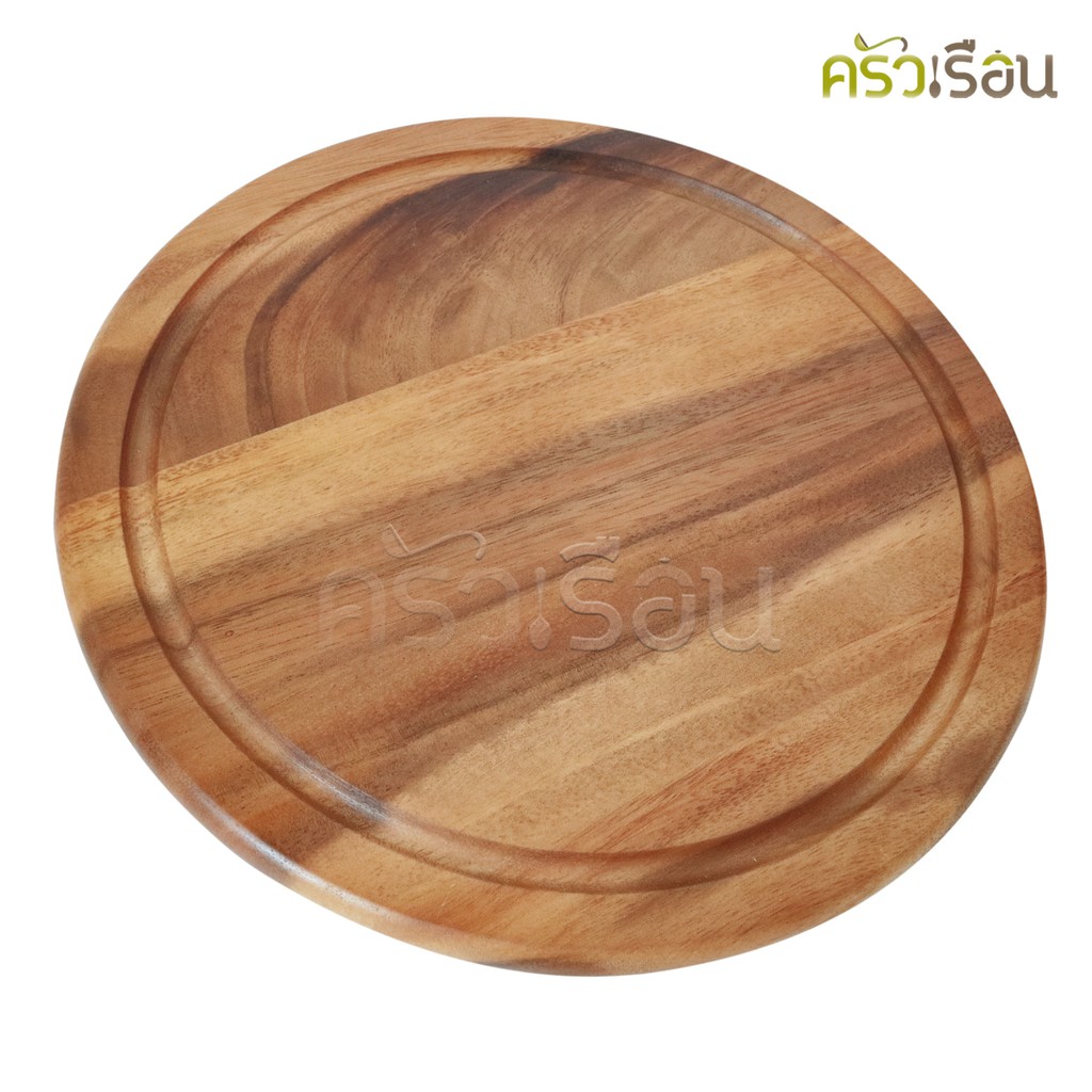 CMG Round acacia wood cutting board with grooves.