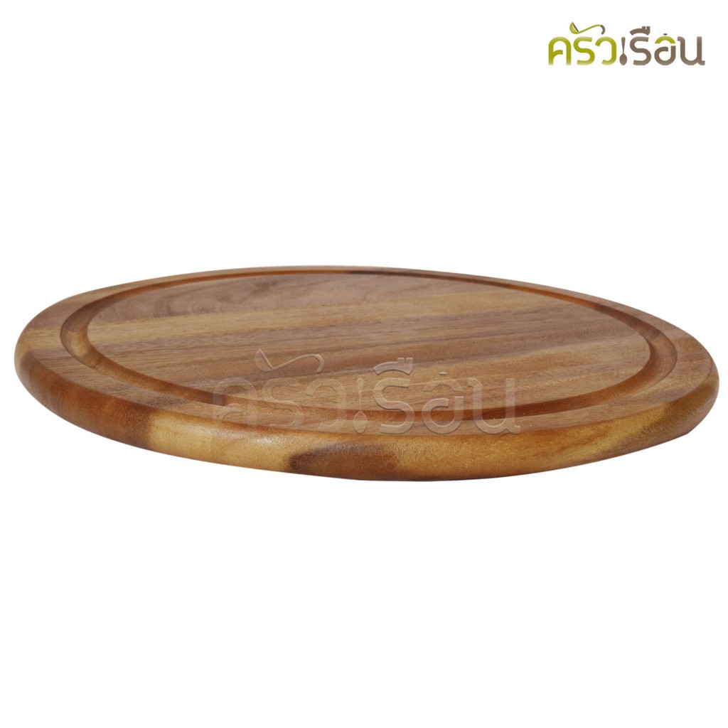 CMG Round acacia wood cutting board with grooves.