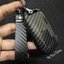 เคสรีโมทรถ KIA Carnival 2022 ลายเคฟล่า (ABS Key Cover Black Silicone Push button Guard) พร้อมพวงกุญแจ